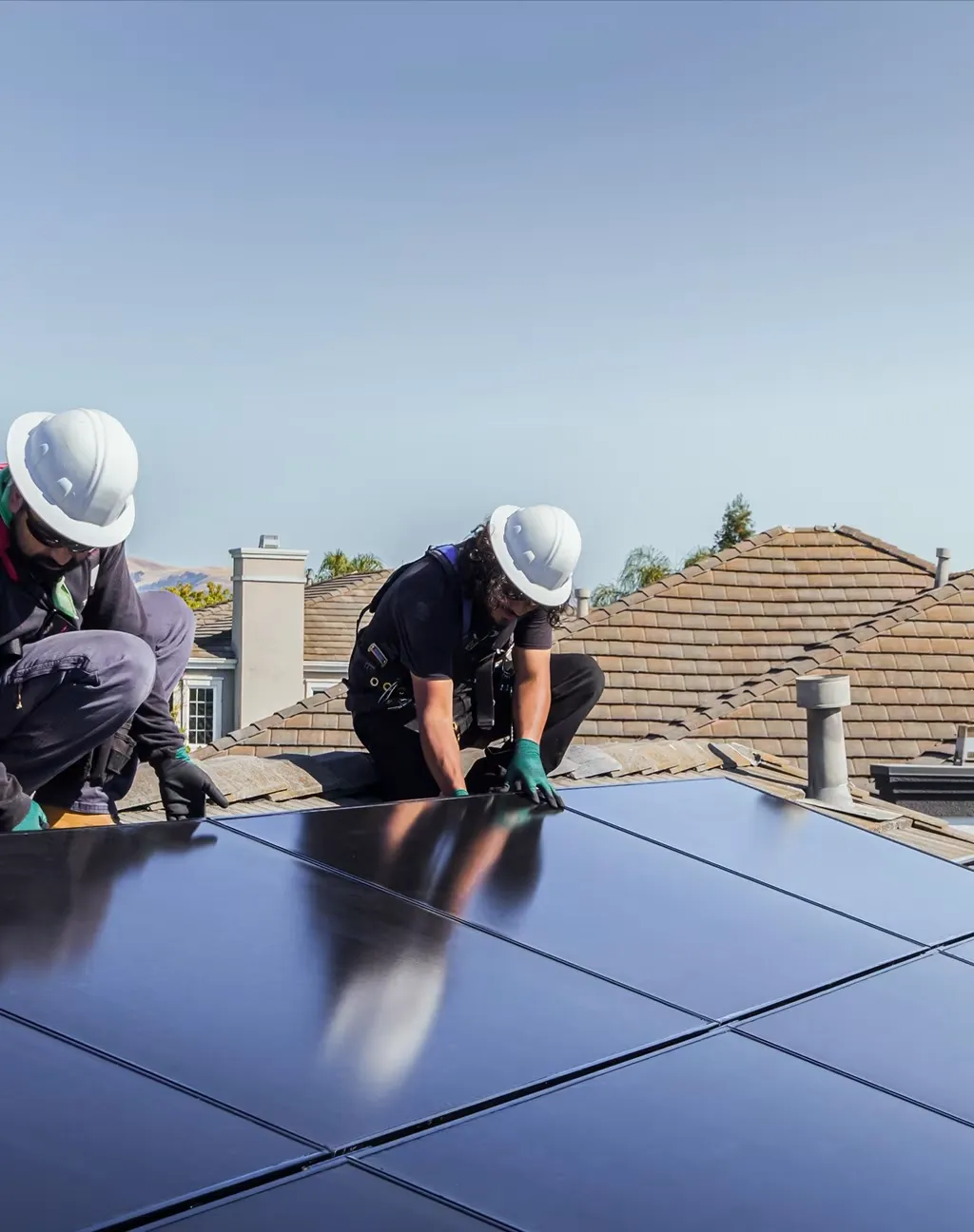 Home with rooftop solar at sunset